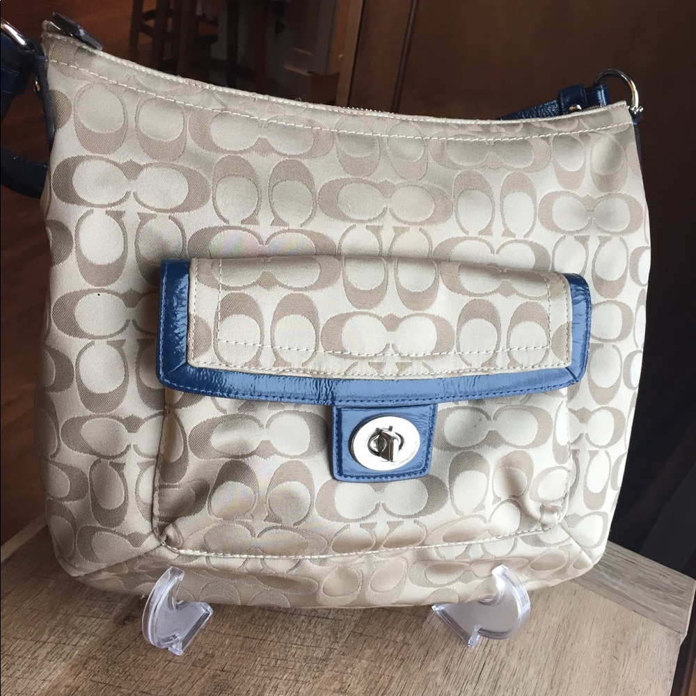 Light brown with navy accent Coach bag